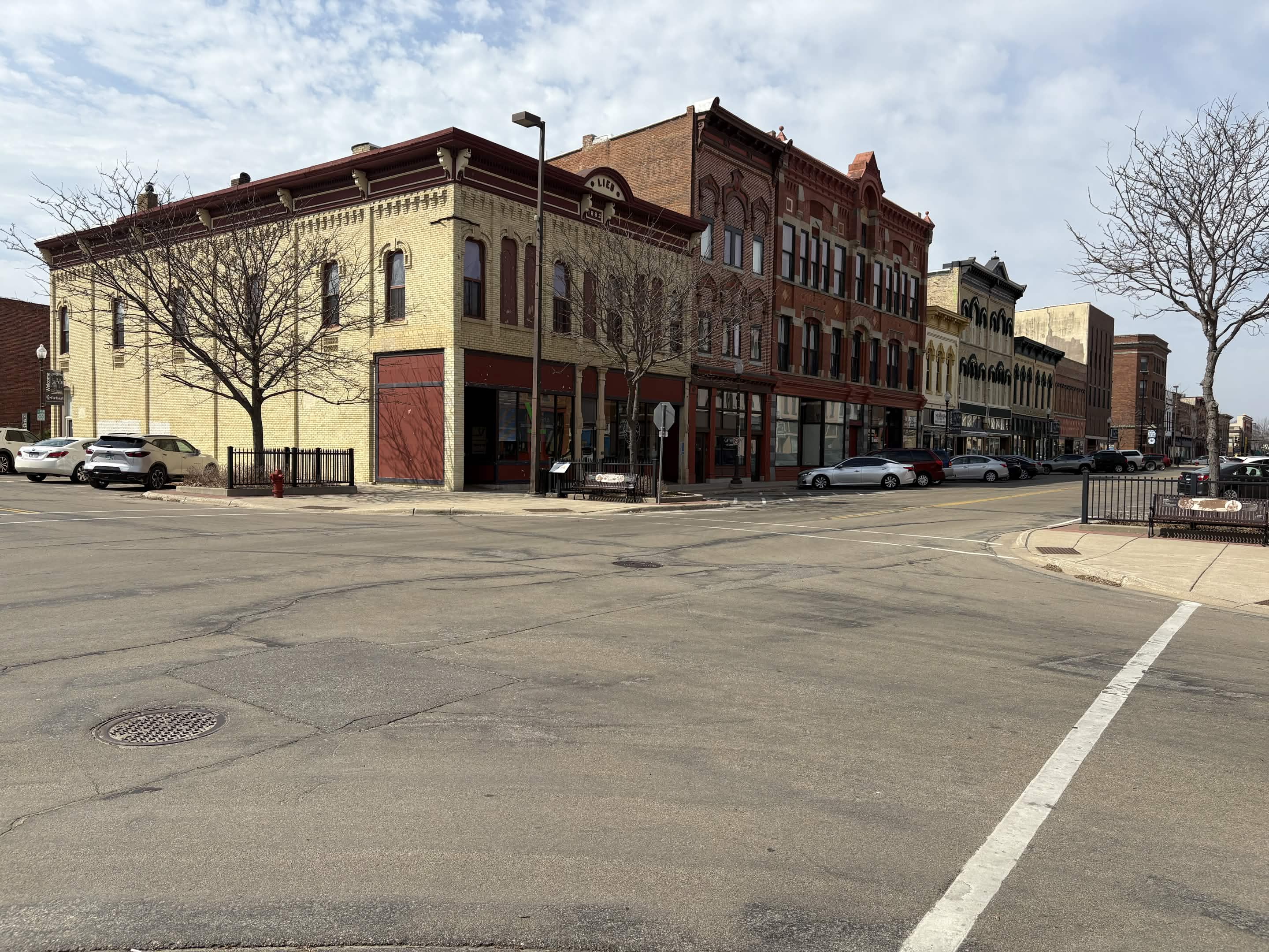 Historic brick storefronts along a downtown Faribault street