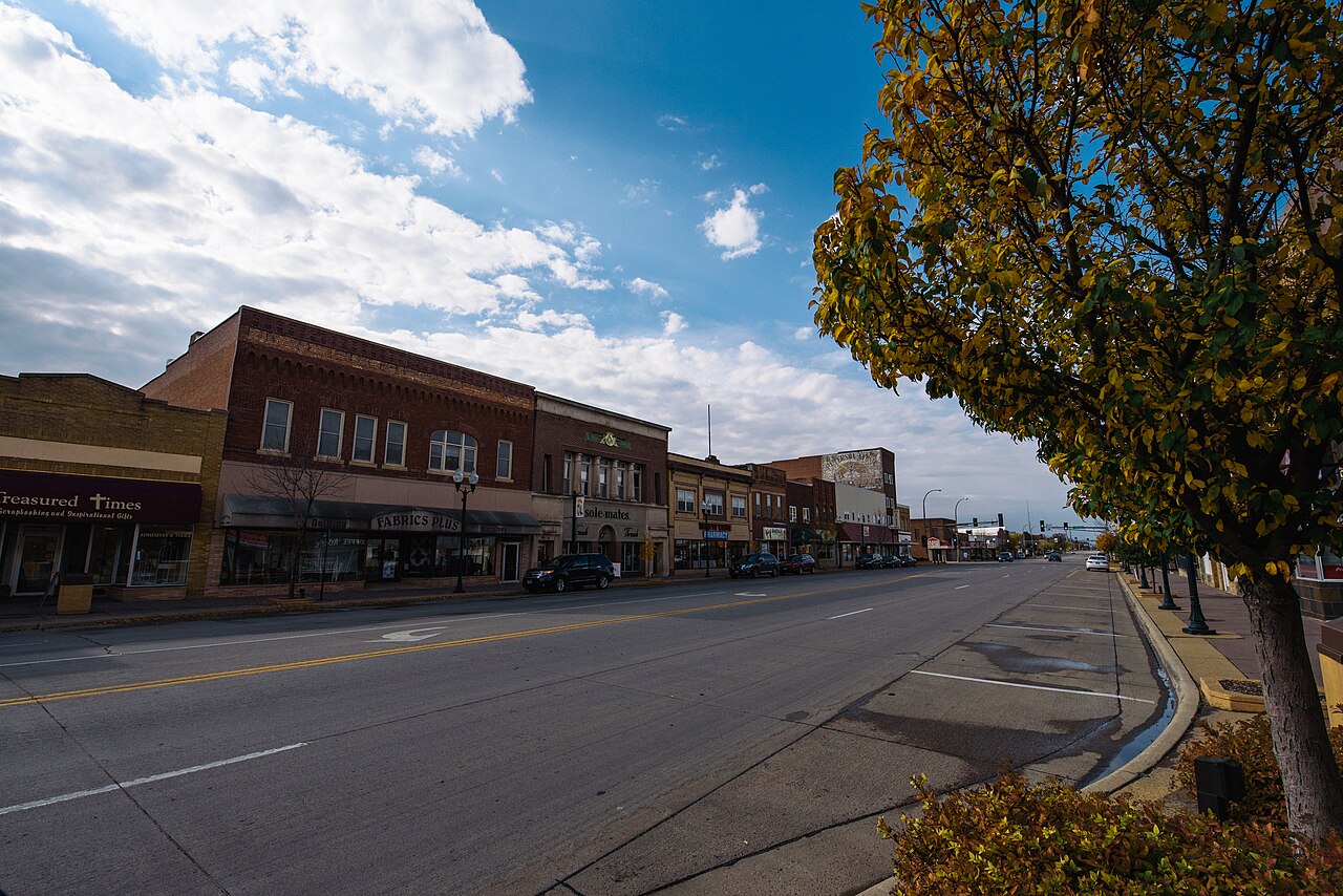 Historic storefronts and autumn trees along Main Street in Marshall