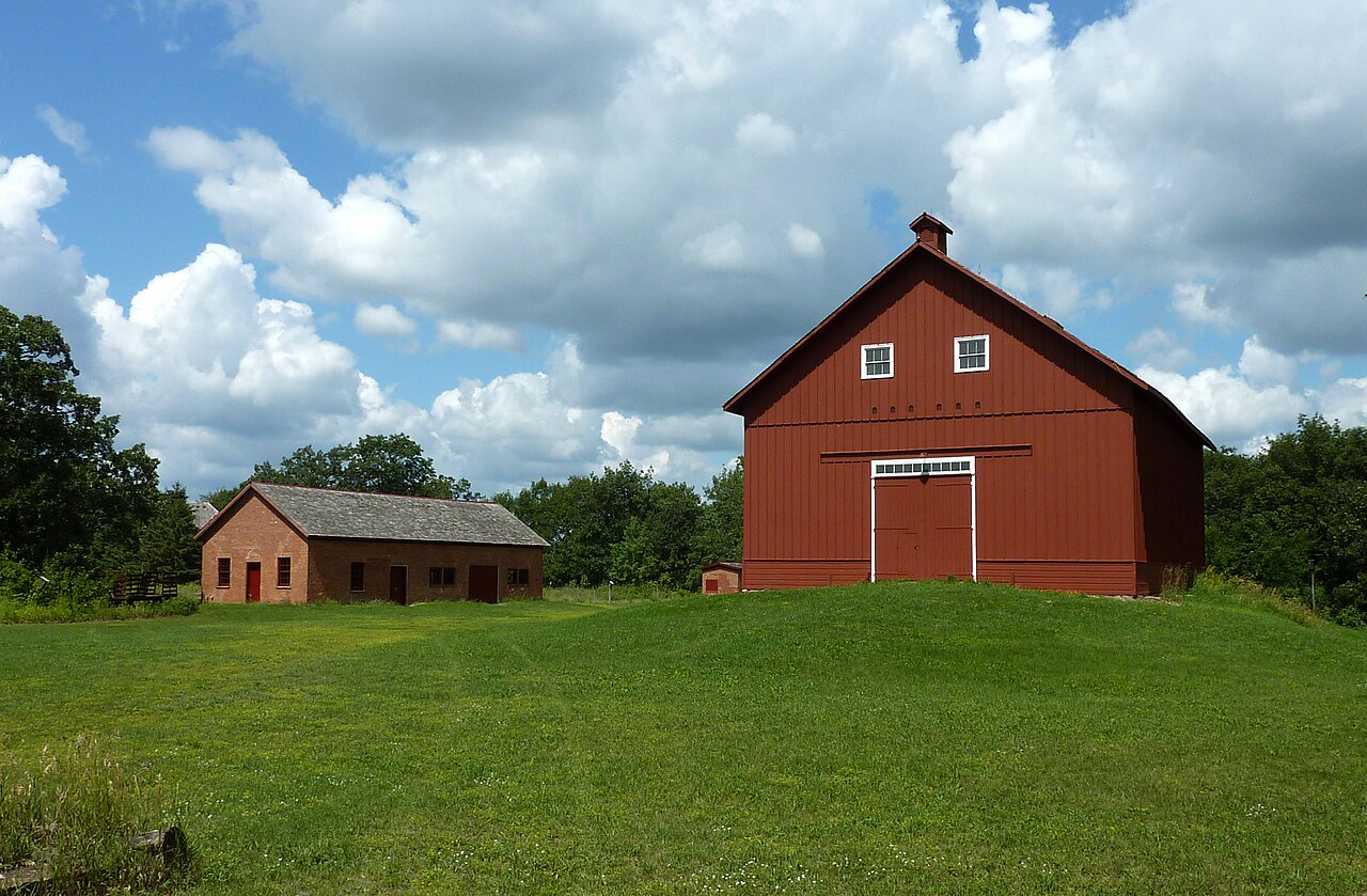 Red granary and brick workshop at the historic North Oaks Farm