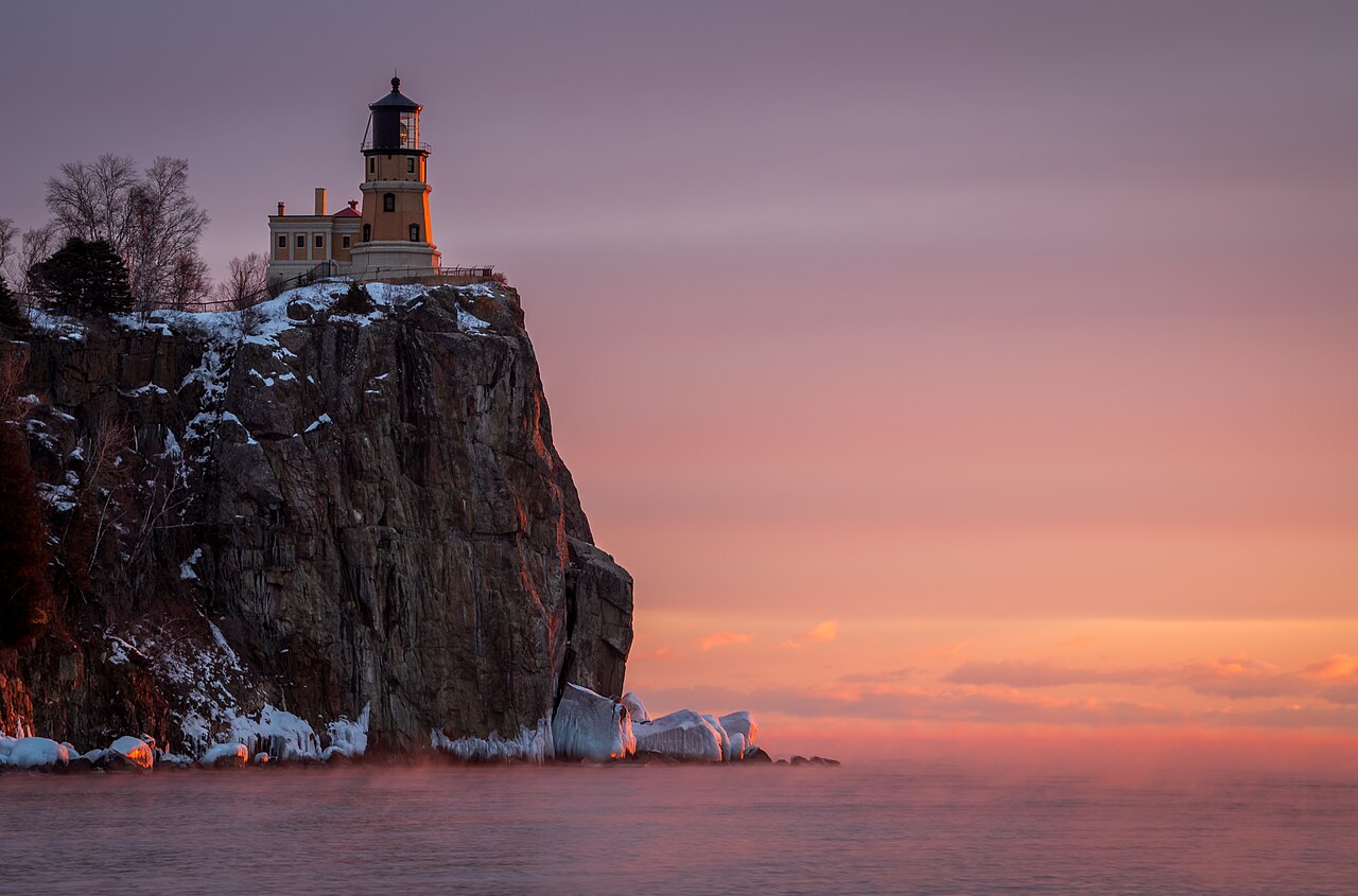 Split Rock Lighthouse above snowy cliffs and Lake Superior near Two Harbors
